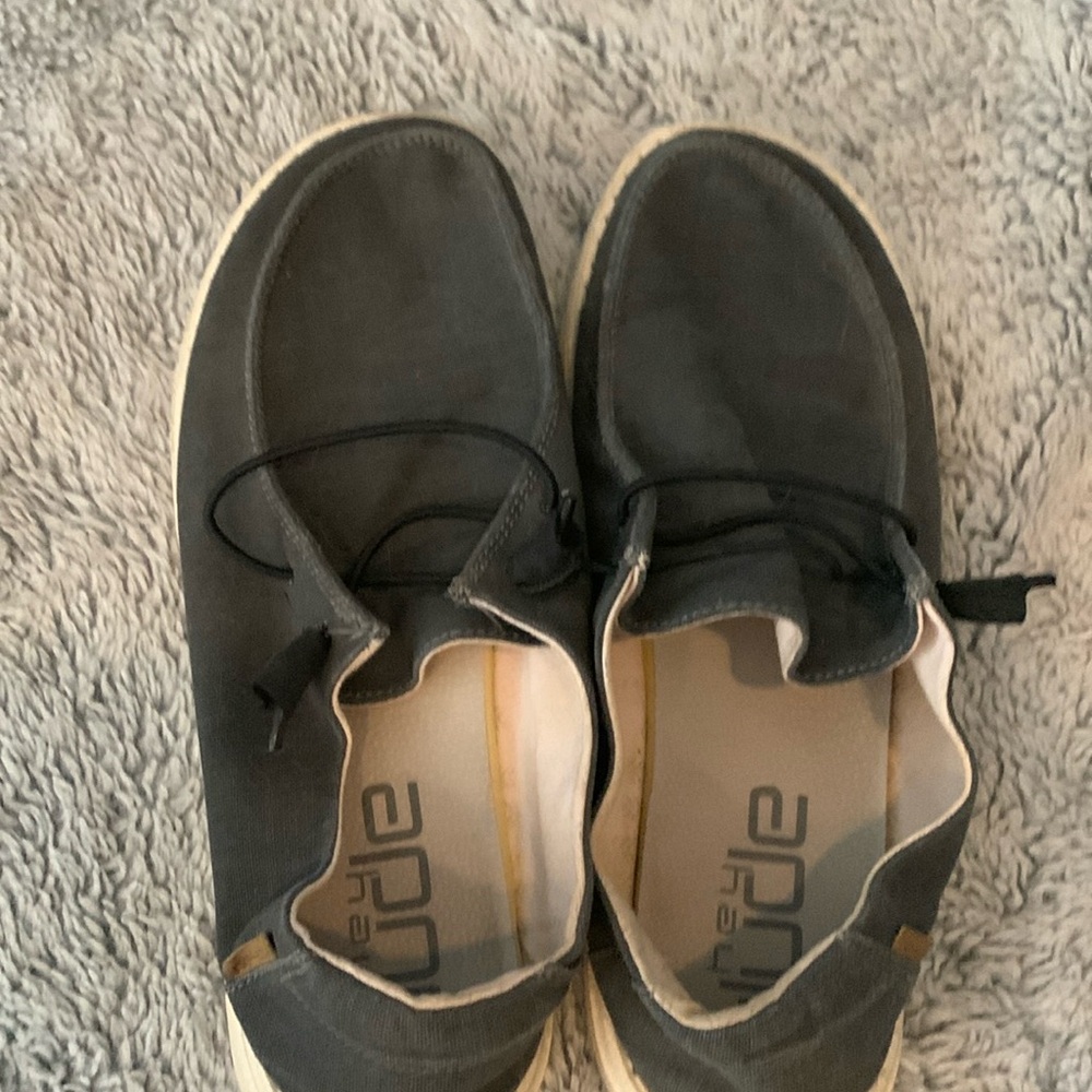 Gently worn women’s black/dark grey Hey Dude shoes.